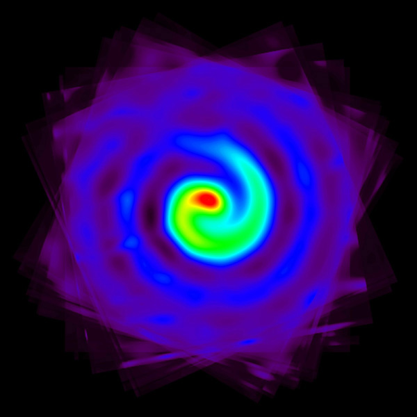 This is an image taken with the Keck Telescope showing a plume of hot dust and gas flung out into a whirling spiral as the two stars at the centre of the system orbit one another every eight months.